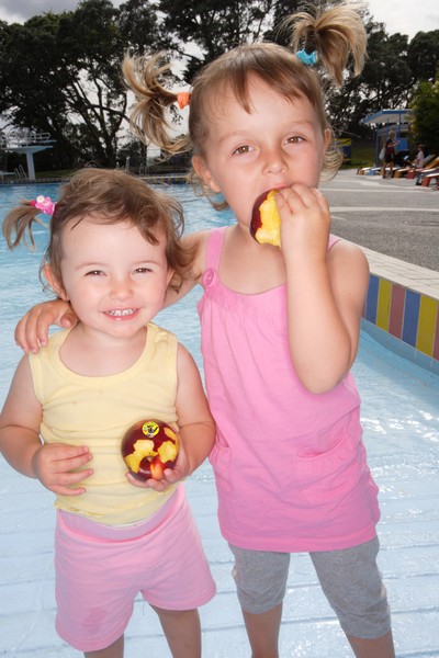 Enjoying the taste of summer: Auckland sisters, Kirra (1 year) and Riley (3 years) enjoy new Yummy Hunnys.